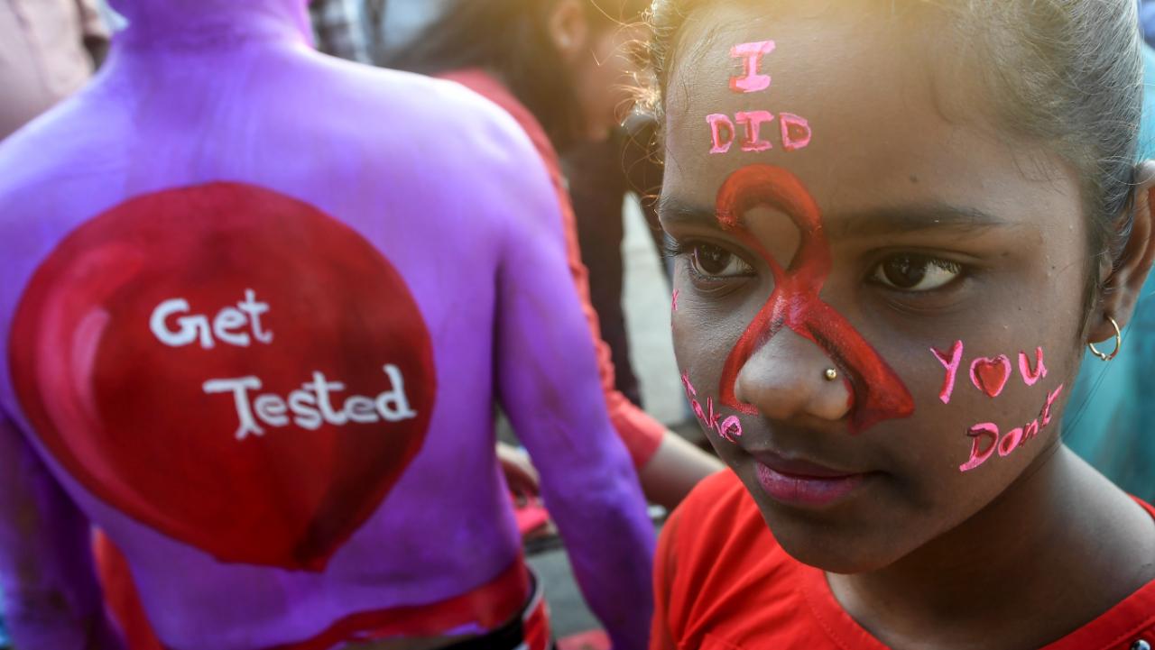 According to statistics shared by India's National AIDS Control Organisation for 2019, an estimate of more than 23 lakh Indians continue to live with HIV AIDS, and Maharashtra had the highest number with 3.96 lakh people. To address this, national campaigns are staged to promote HIV testing, usage of contraceptives and informative conversations around AIDS. Photo courtesy: AFP